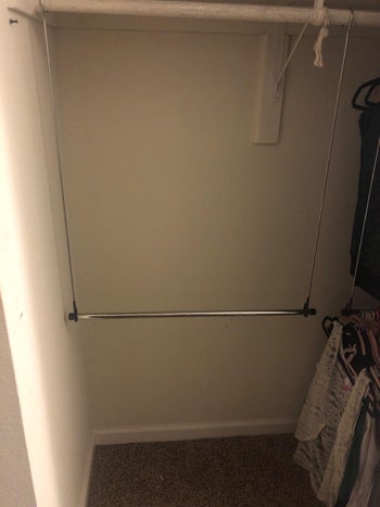 reviewer image of the double rod hanging inside a closet