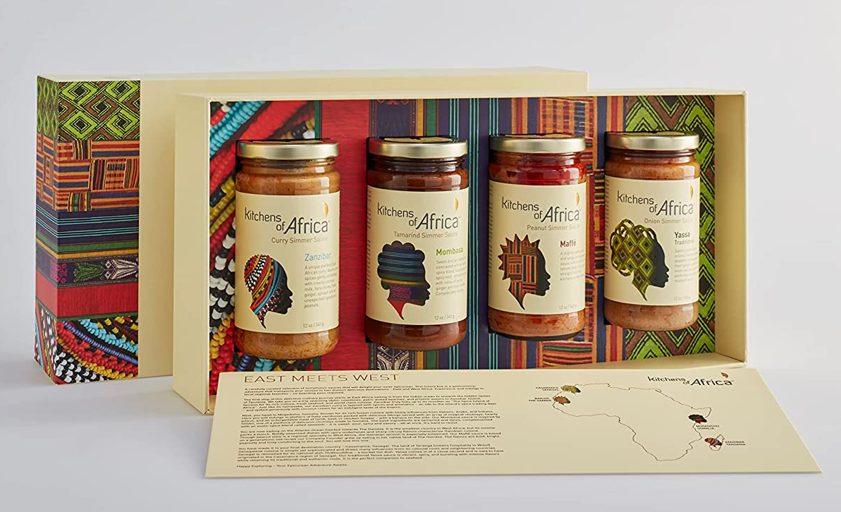 a gift box with four different-flavored jars of sauce inside 