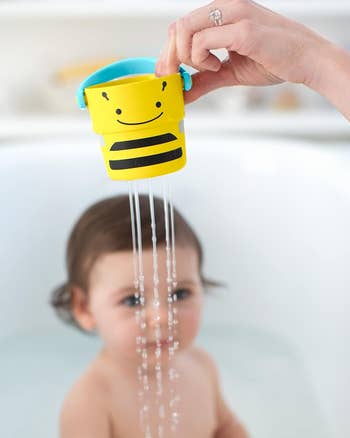 a yellow bee bath bucket toy
