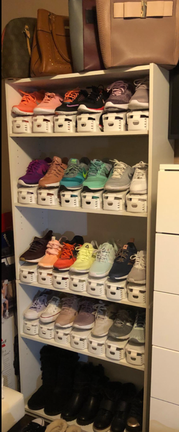 reviewer photo of running sneakers in shoe slots