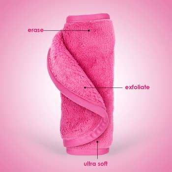 A pink washcloth with an erase and exfoliate side 