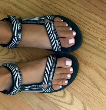 reviewer in the black and white patterned sandals