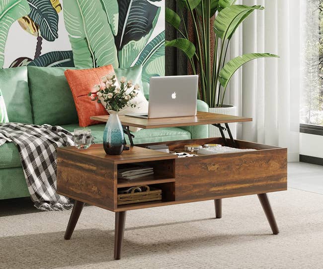 the brown wooden coffee table, which has open shelving on one side