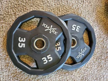 reviewer photo of two 35-pound weight plates
