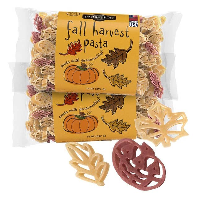 Two packages of fall-themed pasta successful leafage and pumpkin shapes. Packages labeled