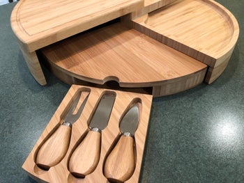 reviewer photo of empty charcuterie board and knife set