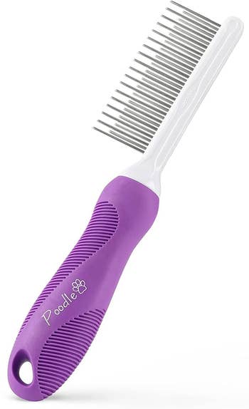 Ergonomic pet grooming comb with a rubber handle and metal teeth, suitable for detangling fur