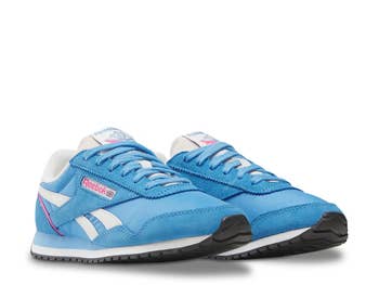 Classic Reebok sneakers with a retro design, featuring the brand's logo connected  the side