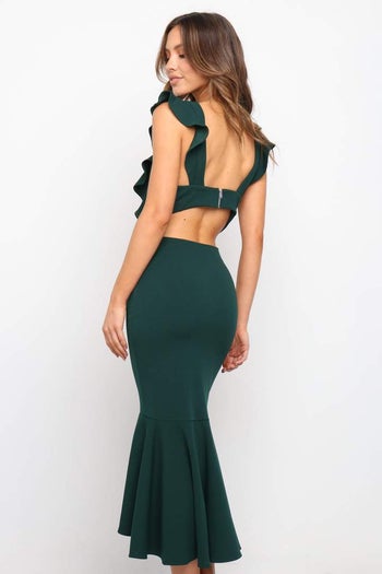 model wearing the green version showing off their bare back