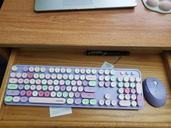 reviewer's purple and black keyboard/mouse set