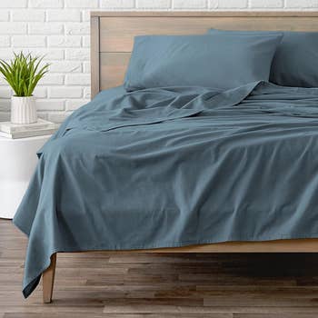 the coronet blue sheet set on a bed