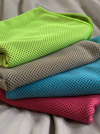 reviewer photo of four multicolored cooling towels