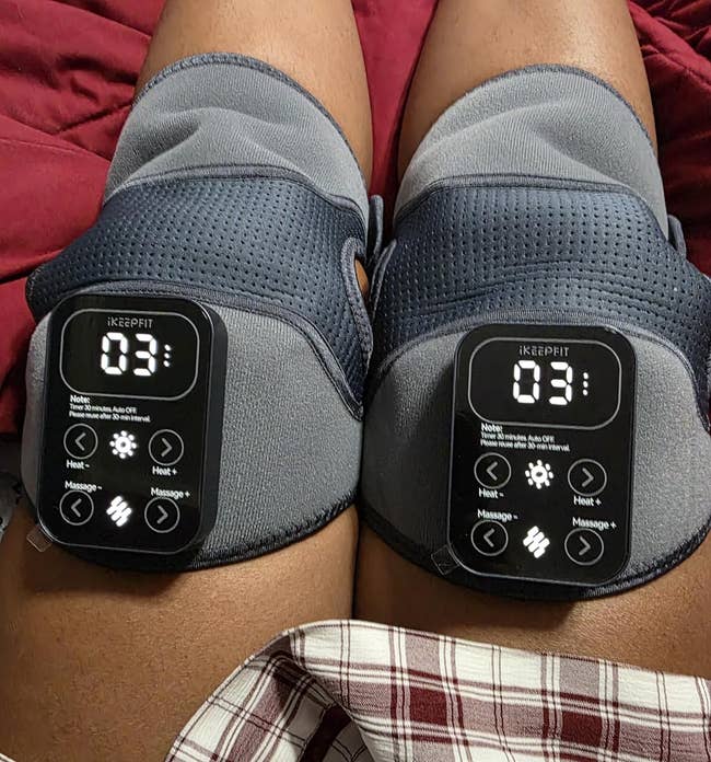 Person utilizing genu therapy devices with integer displays and plaid shorts