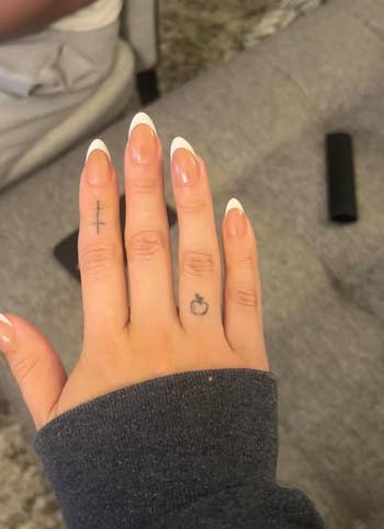 reviewer with the almond shaped nails applied