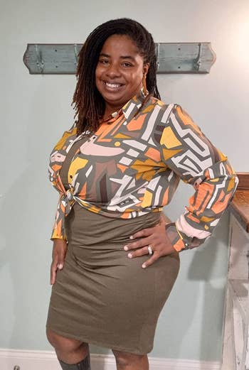 a reviewer wearing the same shirt featuring a more muted multicolor print