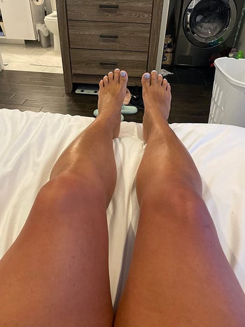 image of reviewer's glowing and tanned legs