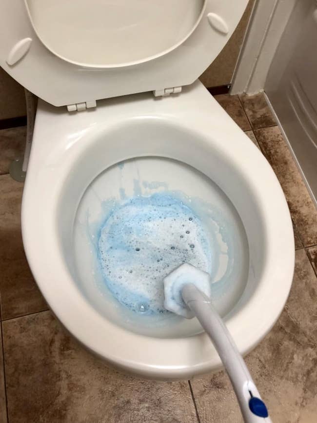 now-clean toilet filled with blue foam from Clorox wand 