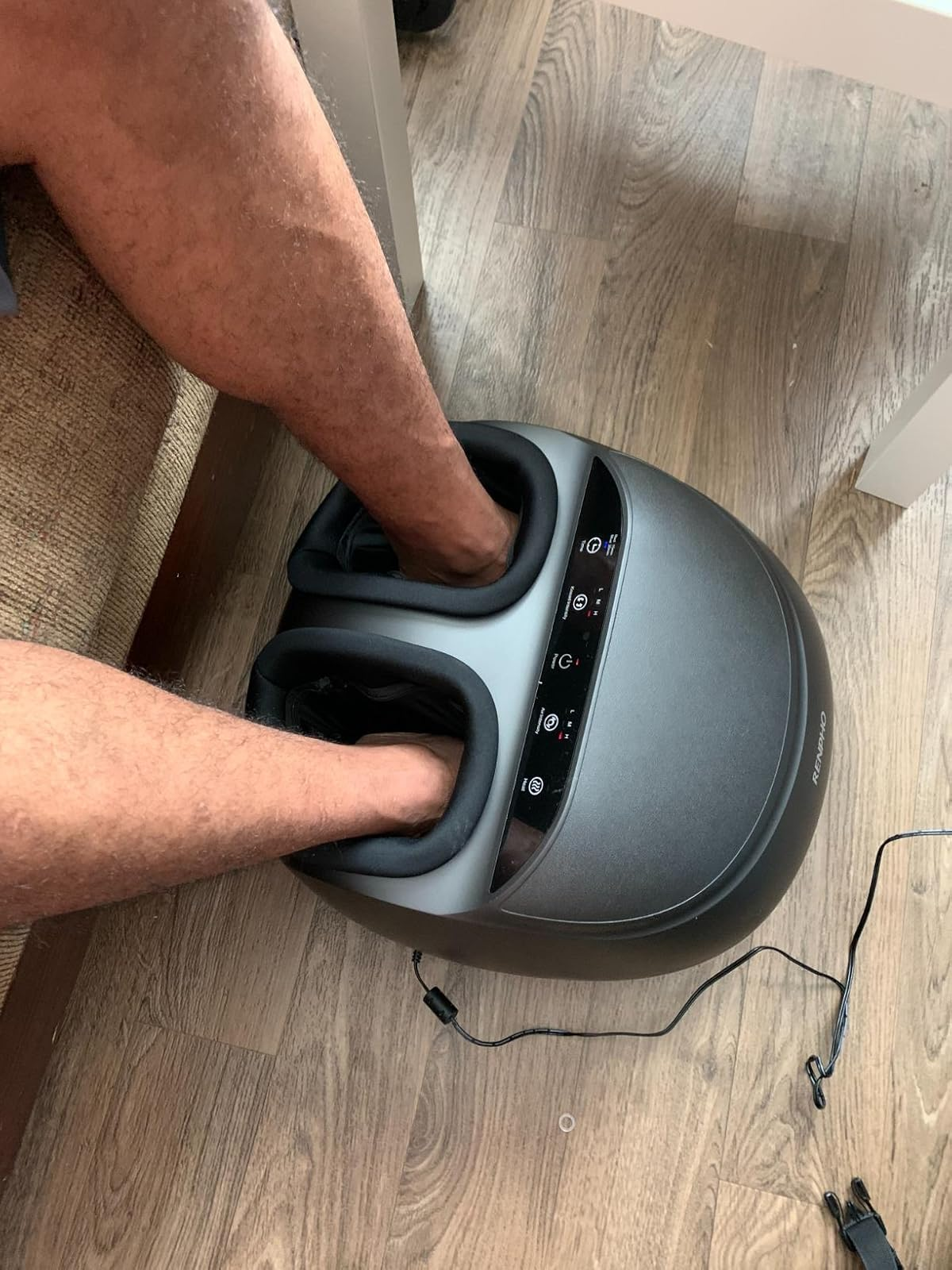 another reviewer using a foot massager with feet placed inside the device