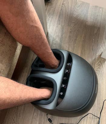 another reviewer using a foot massager with feet placed inside the device