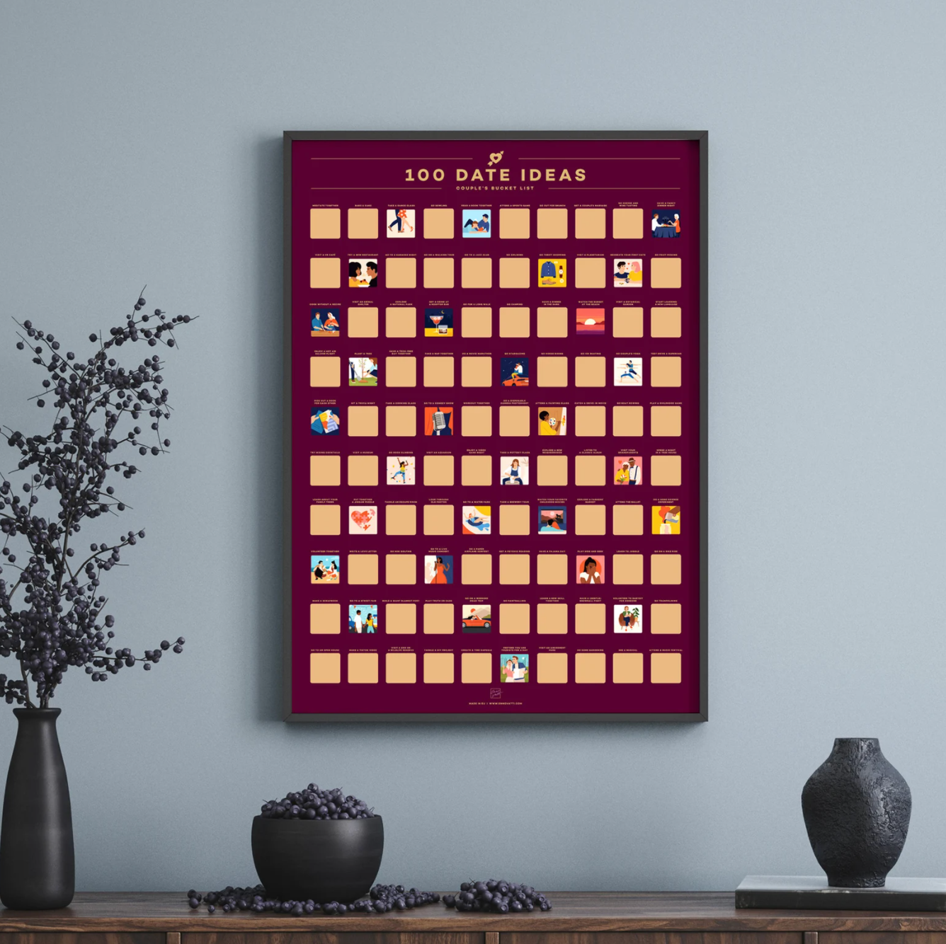 100 date ideas scratch off poster hanging on a wall