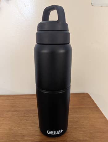 a reviewer photo of a black water bottle 
