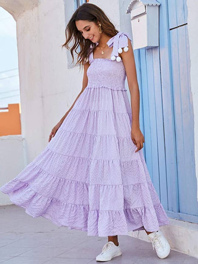 model wearing long tiered maxi with sneakers