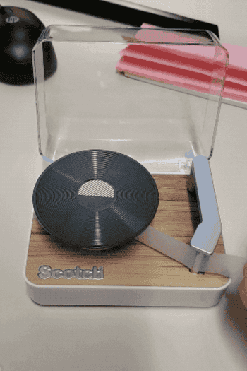 a reviewer's gif of them using the tape dispenser