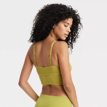 model showing the back of the longline bralette in green