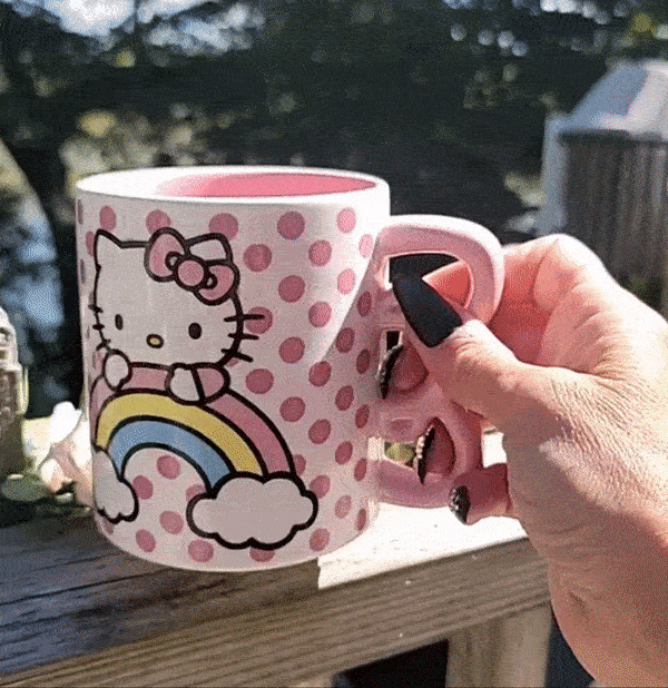 Gif of reviewer picking up the Hello Kitty mug