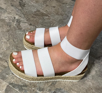 Reviewer wearing white platform espadrille sandals