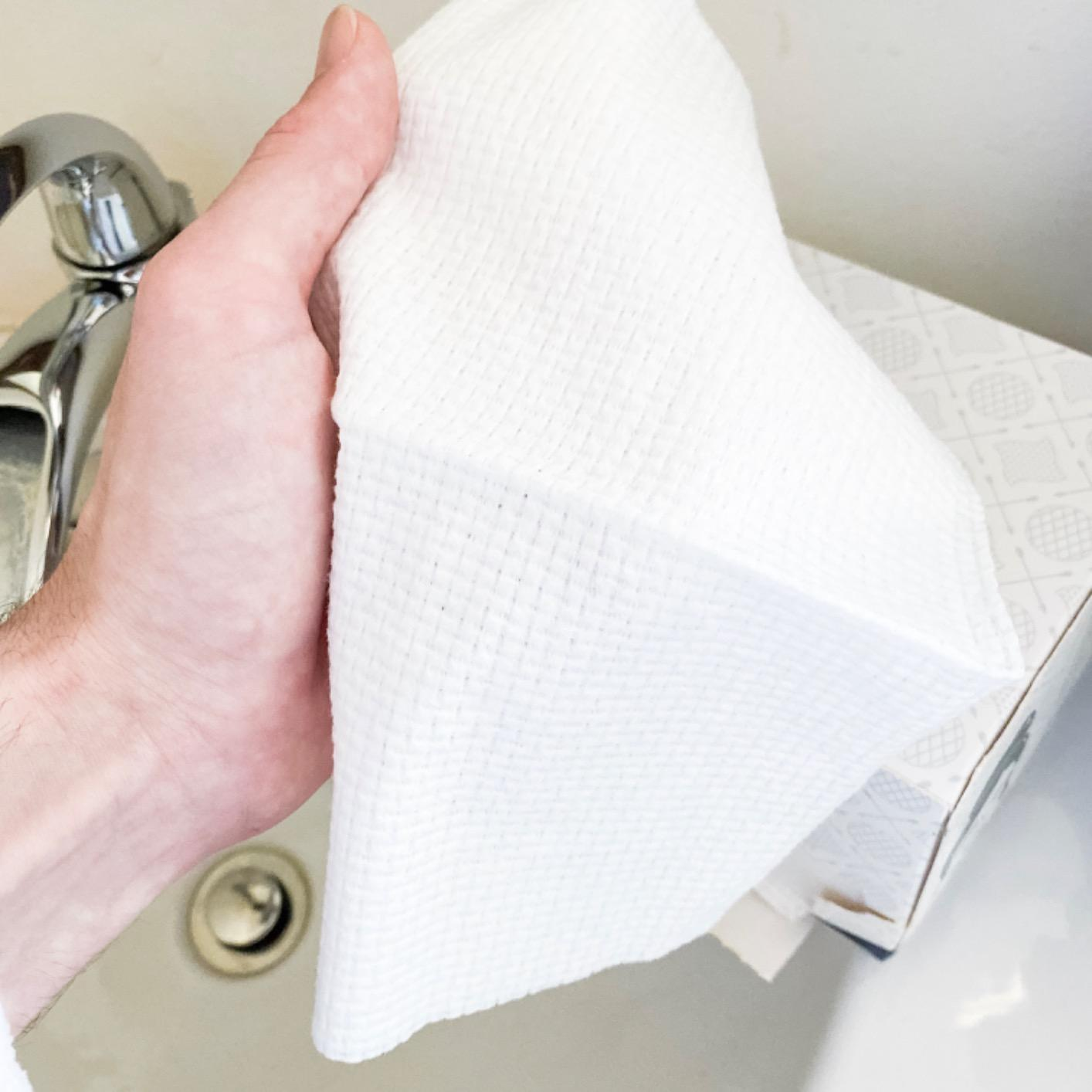 reviewer holding one of the towels