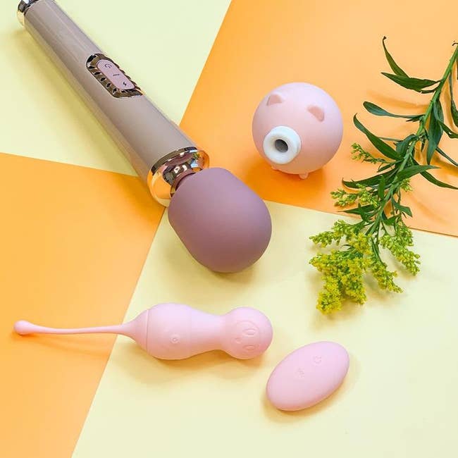 Muted pink wand vibrator, pink pig-shaped suction vibrator and pink kegel egg vibrator with wireless remote
