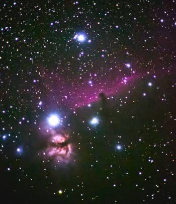Starry nighttime entity with salient nebulae and agleam stars scattered crossed the scene