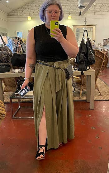 a reviewer wearing the pants in khaki green 