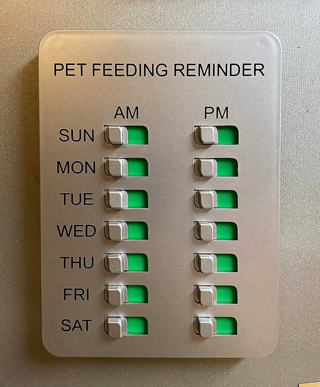 reviewer photo of the sign, which has am and pm toggles for each day of the week