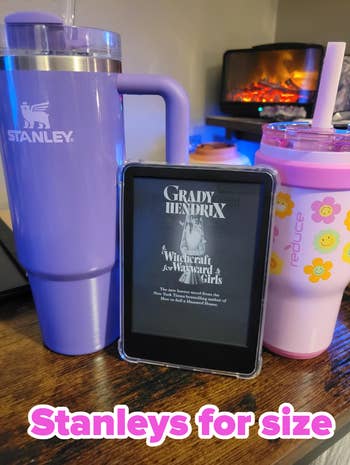 Large Stanley tumbler, Reduce cup, and e-reader displaying 