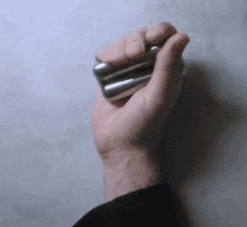 Model demonstrating how the two cylinder stainless steel roller can be fidgeted with one hand or two 