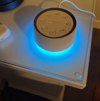 reviewer image of the sound machine emitting a blue light