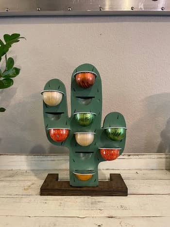 The green cactus holding eight nespresso pods