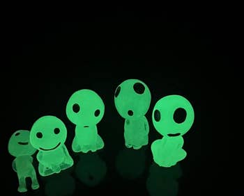 six glowing alien figurines 