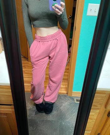 a reviewer wearing the pink sweatpants