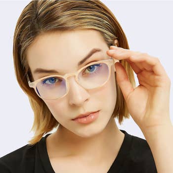 model wearing the beige blue light-blocking glasses