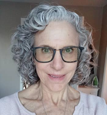 reviewer with curly gray hair
