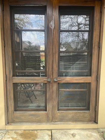 reviewer before image of a dull and scratched wooden door