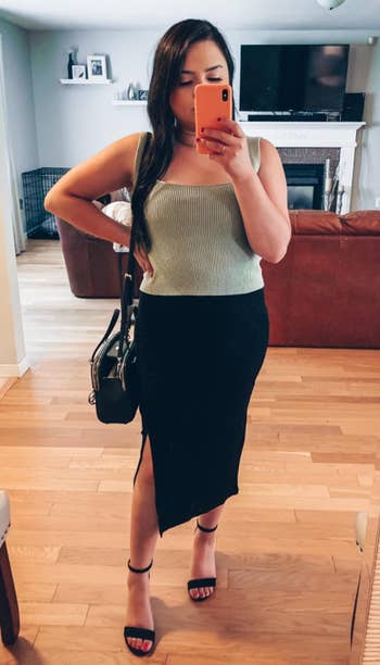 a reviewer wearing the skirt in black 