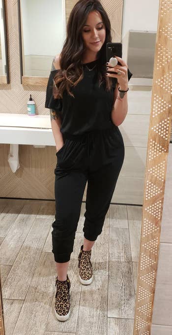 reviewer wearing the black jumpsuit
