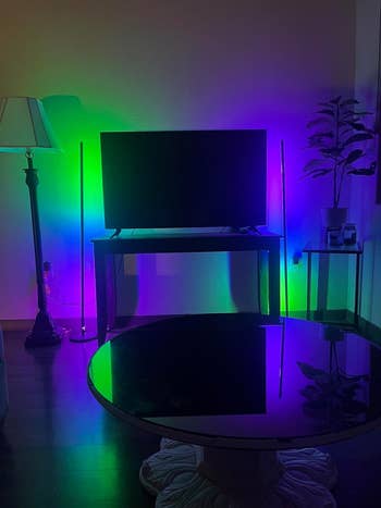 reviewer's TV with two of these lights on either side lit up green, blue and purple
