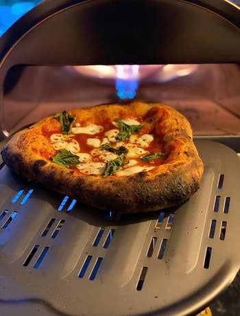 reviewer's pizza they made in the pizza oven