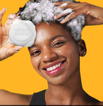 Person smiling portion washing hairsbreadth with a