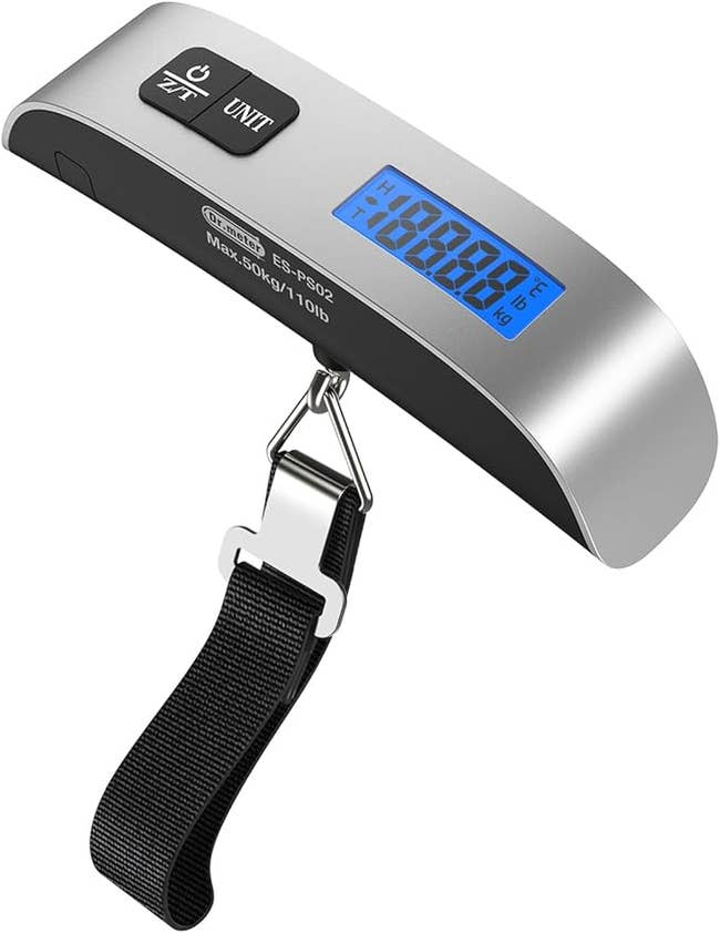 Portable digital luggage scale with a metallic handle and blue digital screen displaying weight